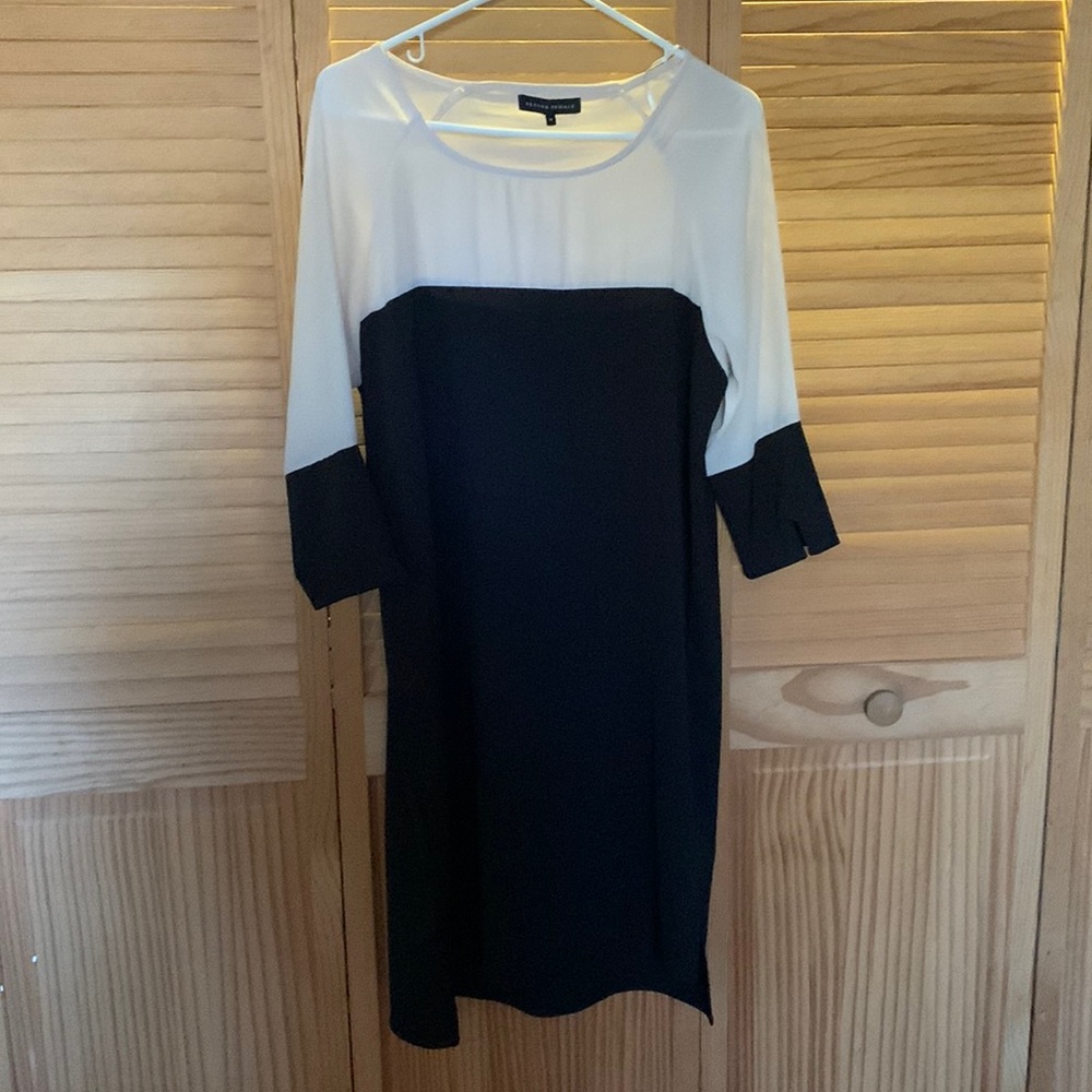 Black and cream color block dress, 3/4 sleeve, slight high/low hem.